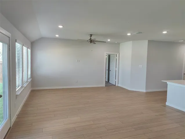 a view of an empty room with a window