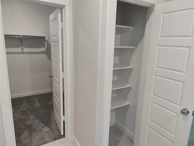 a view of an empty walk in closet