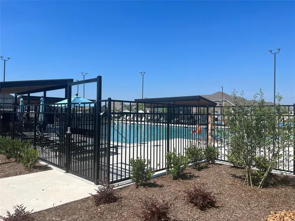 a view of a house with a fence