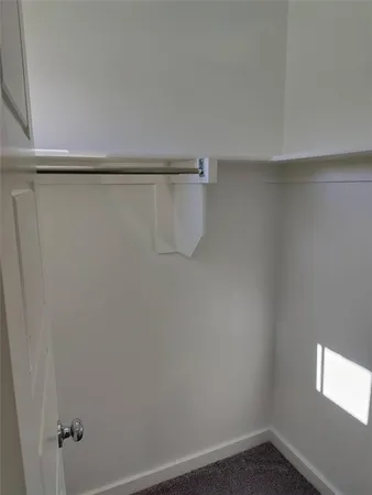 a view of a room with racks on the wall
