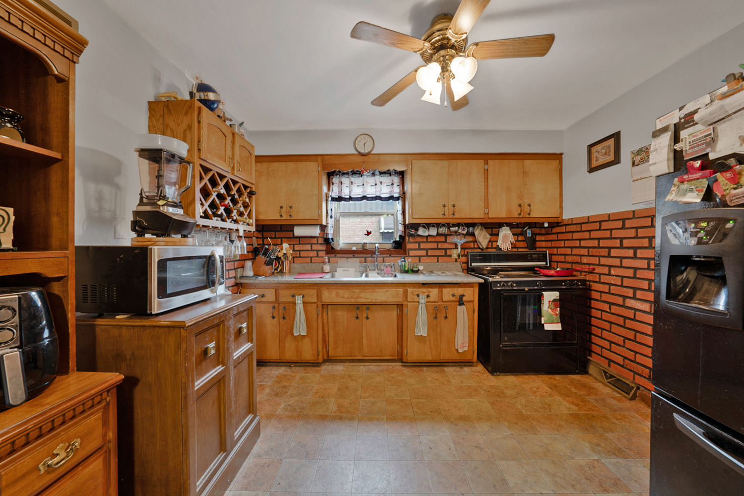10943 Princess Avenue Chicago Ridge, IL 60415 - Photo 6 of 18 a kitchen with stainless steel appliances granite countertop a stove top oven a sink a counter space and cabinets