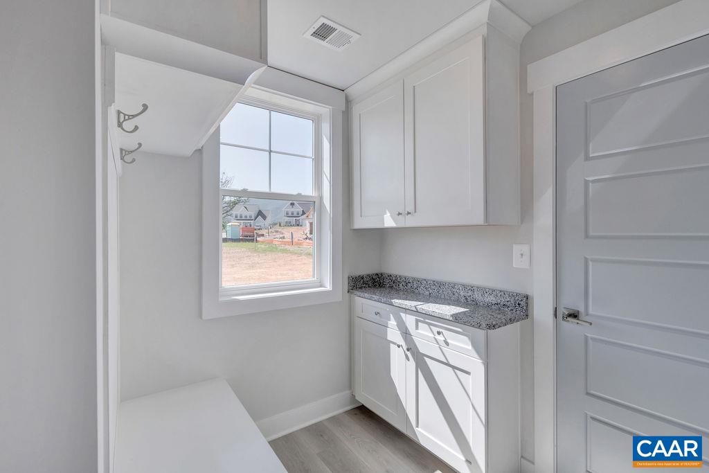 466 Claibourne Road Crozet, VA 22932 - Photo 15 of 39 a kitchen with a white cabinets and window