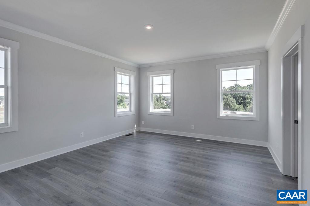 466 Claibourne Road Crozet, VA 22932 - Photo 22 of 39 an empty room with wooden floor and windows
