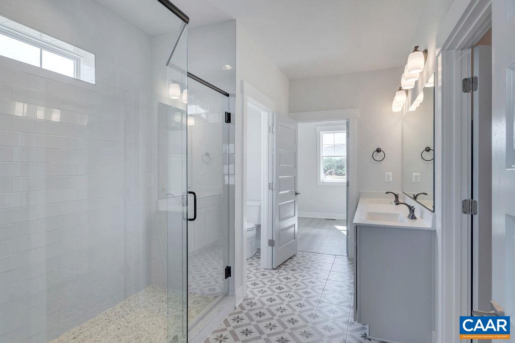 466 Claibourne Road Crozet, VA 22932 - Photo 23 of 39 a bathroom with a sink and mirror