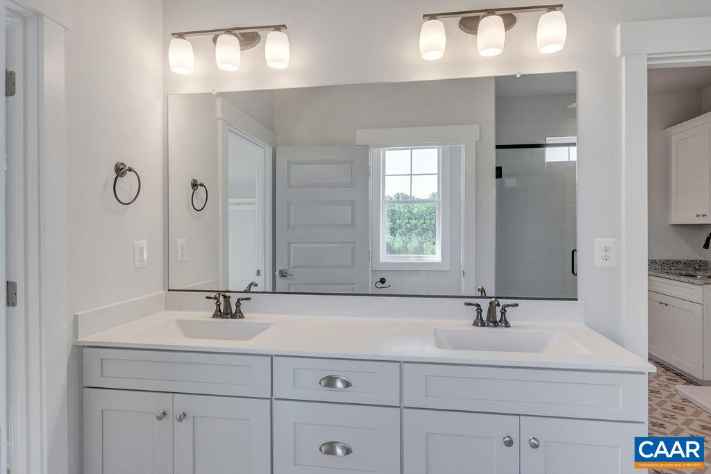 466 Claibourne Road Crozet, VA 22932 - Photo 27 of 39 a bathroom with double vanity sink and a mirror