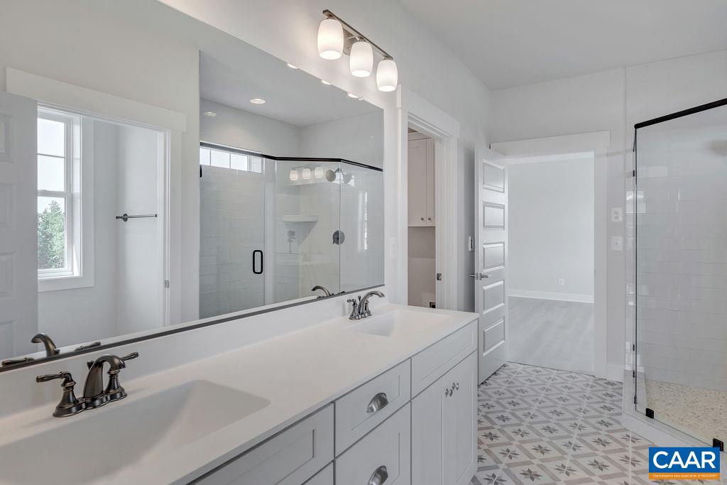 466 Claibourne Road Crozet, VA 22932 - Photo 29 of 39 a bathroom with a sink and a mirror