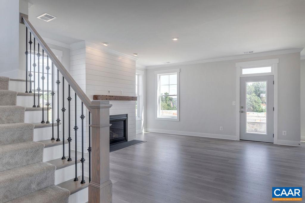 466 Claibourne Road Crozet, VA 22932 - Photo 3 of 39 a view of a livingroom with wooden floor and staircase