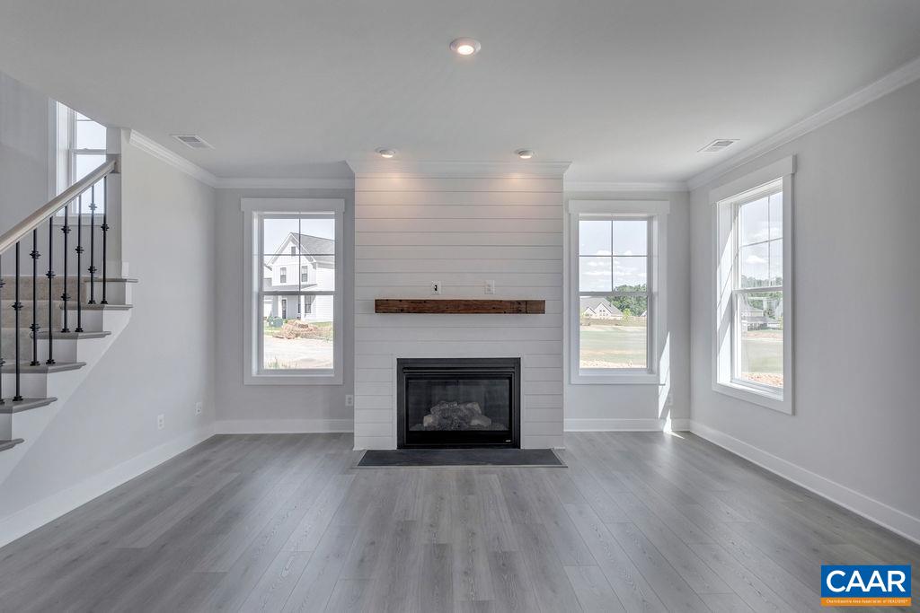466 Claibourne Road Crozet, VA 22932 - Photo 4 of 39 an empty room with windows and fireplace