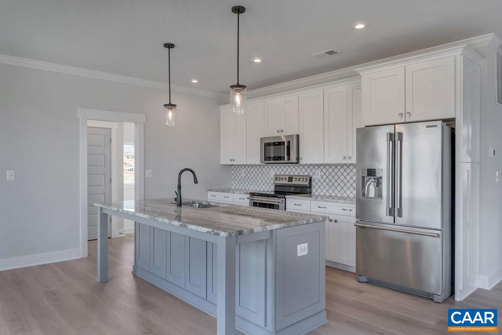 466 Claibourne Road Crozet, VA 22932 - Photo 10 of 39 a kitchen with a refrigerator a sink and dishwasher
