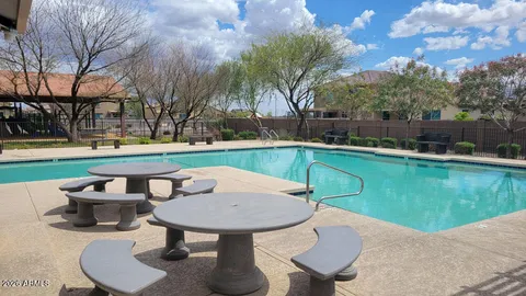 a view of a swimming pool with a patio