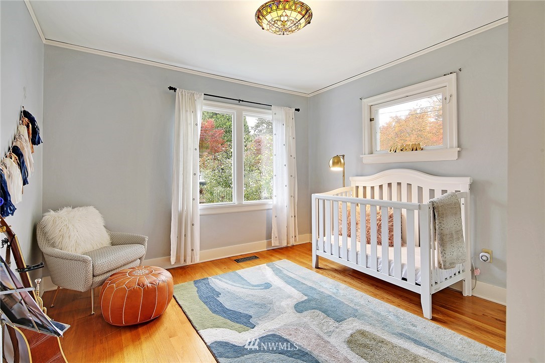 1039 Northeast 91st Street Seattle, WA 98115 - Photo 7 of 25 a bedroom with furniture and a window