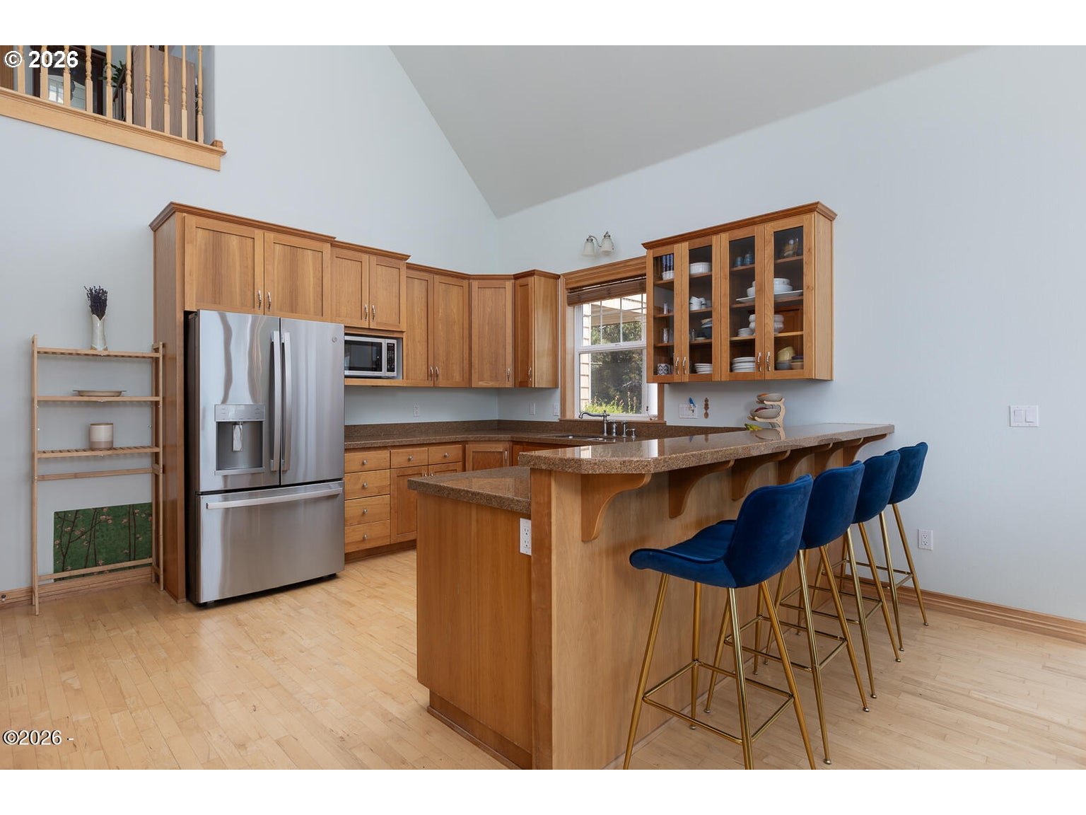 5340 Haystack Drive Neskowin, OR 97149 - Photo 11 of 48 a kitchen with stainless steel appliances granite countertop a refrigerator a sink a stove and island