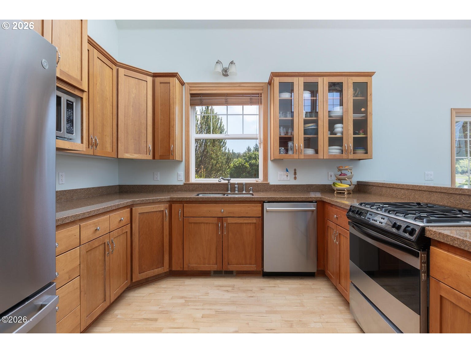 5340 Haystack Drive Neskowin, OR 97149 - Photo 12 of 48 a kitchen with stainless steel appliances granite countertop a stove a sink and a microwave