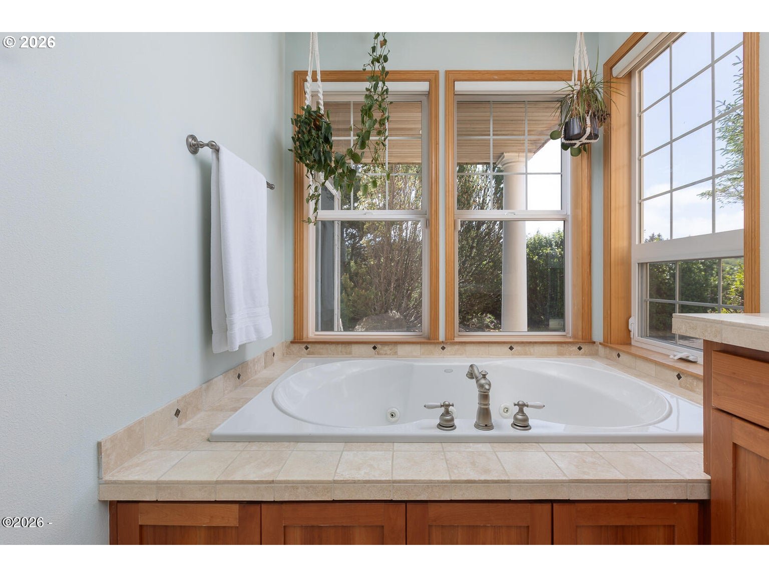 5340 Haystack Drive Neskowin, OR 97149 - Photo 18 of 48 a bathroom with a granite countertop sink and mirror with bathtub
