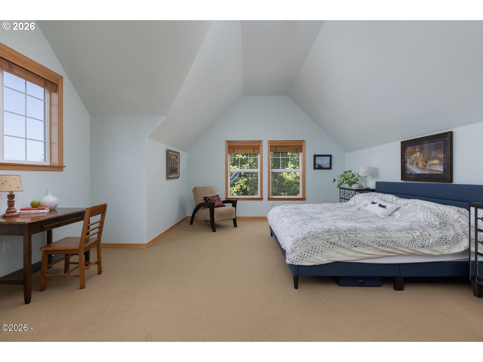 5340 Haystack Drive Neskowin, OR 97149 - Photo 27 of 48 a bedroom with a bed and a table in it