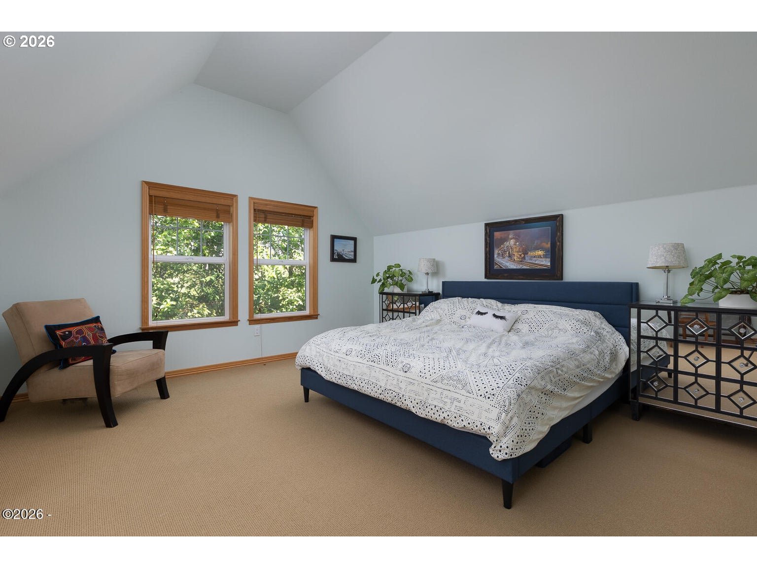 5340 Haystack Drive Neskowin, OR 97149 - Photo 28 of 48 a bedroom with a bed a table and windows