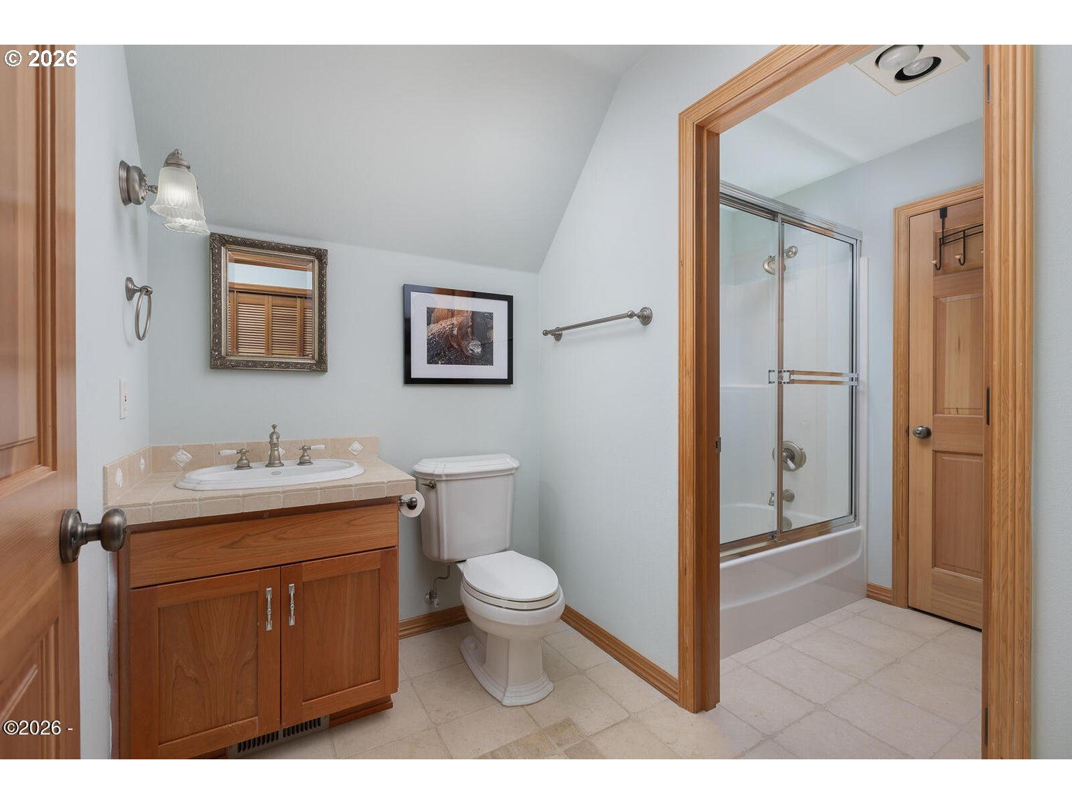 5340 Haystack Drive Neskowin, OR 97149 - Photo 29 of 48 a bathroom with a granite countertop toilet a sink and mirror