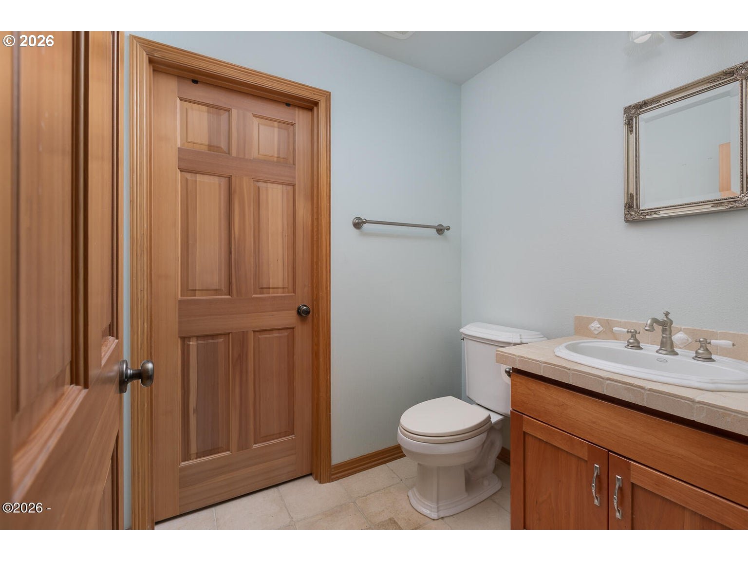 5340 Haystack Drive Neskowin, OR 97149 - Photo 32 of 48 a bathroom with a toilet a sink and mirror