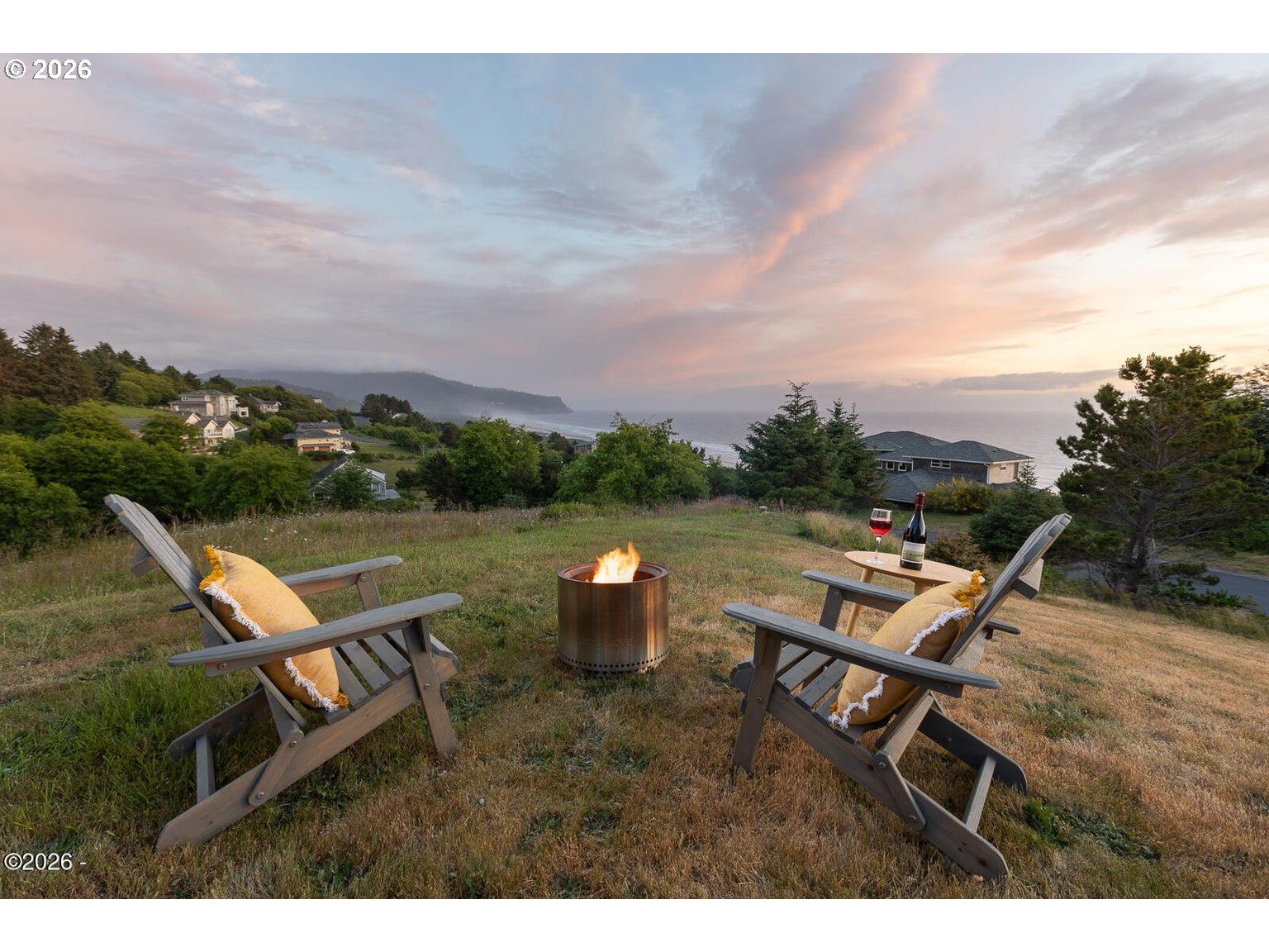 5340 Haystack Drive Neskowin, OR 97149 - Photo 38 of 48 a backyard of a house with table and chairs