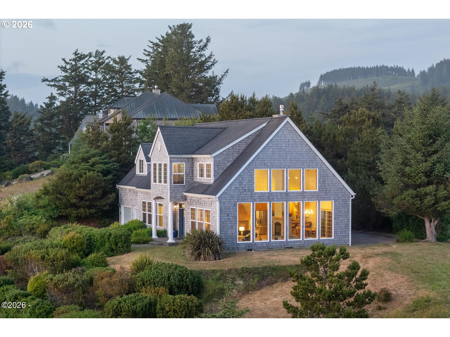 5340 Haystack Drive Neskowin, OR 97149 - Photo 39 of 48 a view of a big house with a big yard and large trees