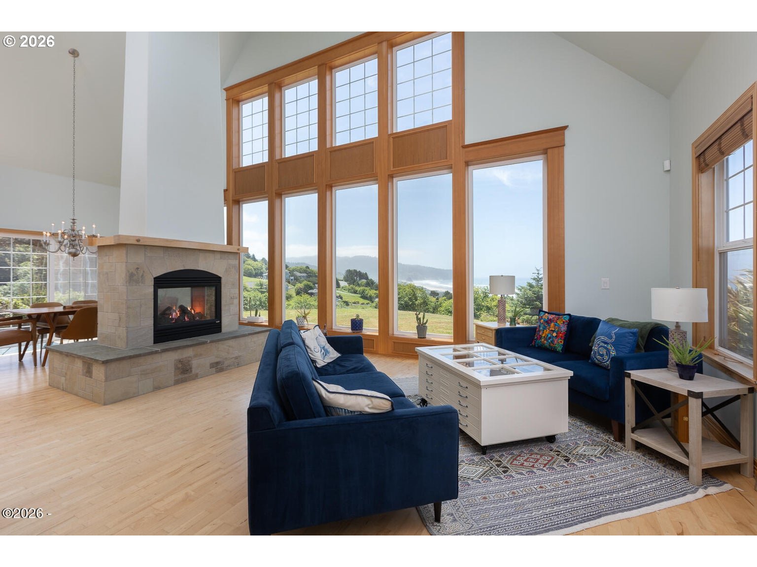 5340 Haystack Drive Neskowin, OR 97149 - Photo 5 of 48 a living room with furniture large window and fireplace