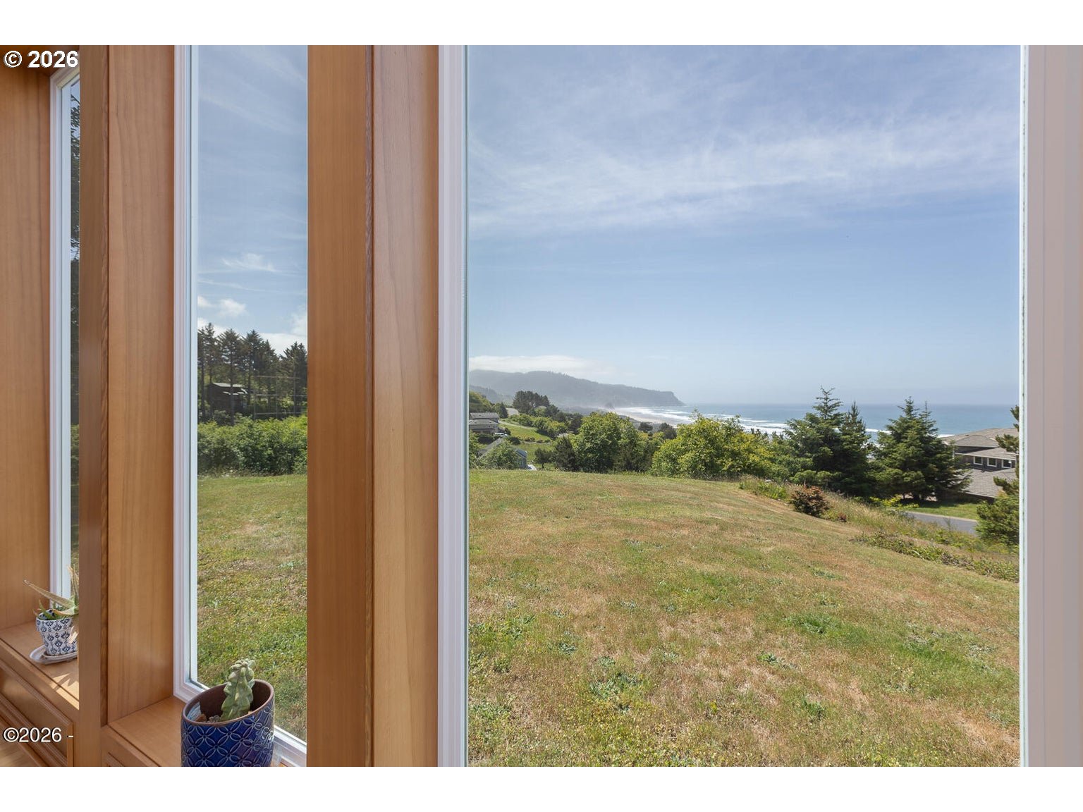 5340 Haystack Drive Neskowin, OR 97149 - Photo 7 of 48 a view of a floor to ceiling window and a yard