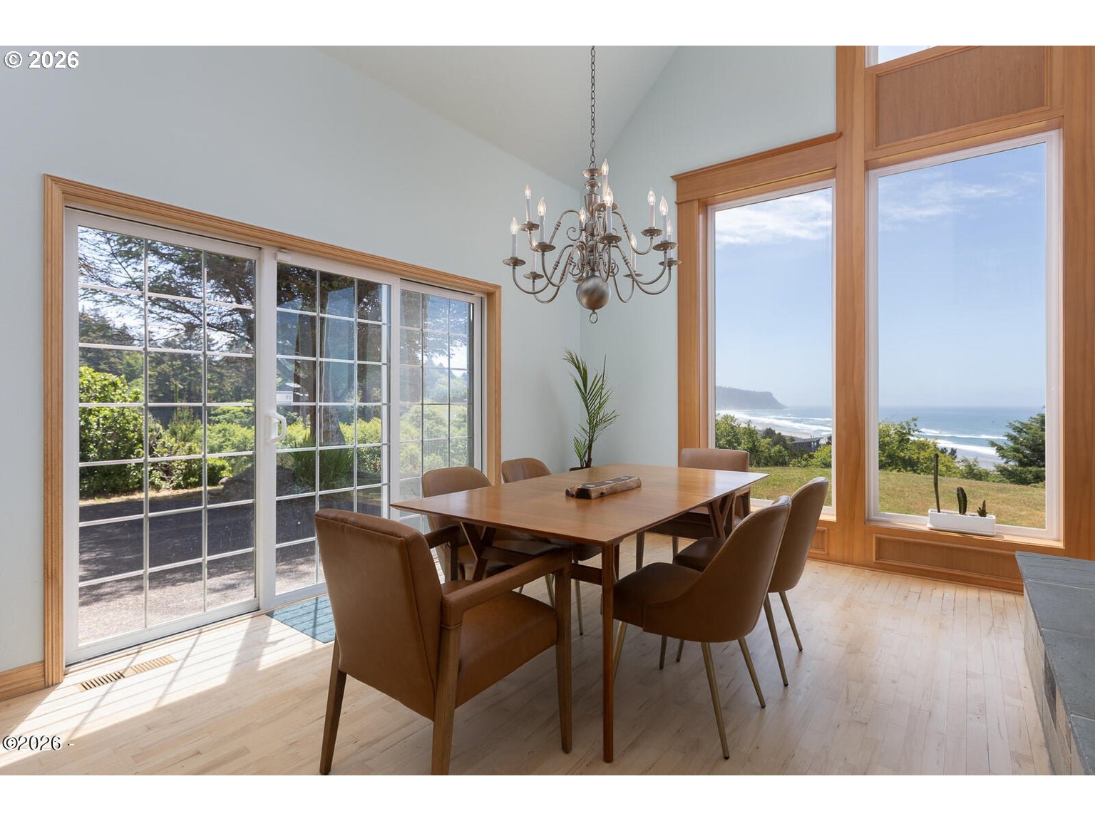 5340 Haystack Drive Neskowin, OR 97149 - Photo 10 of 48 a dining room with furniture wooden floor and a chandelier