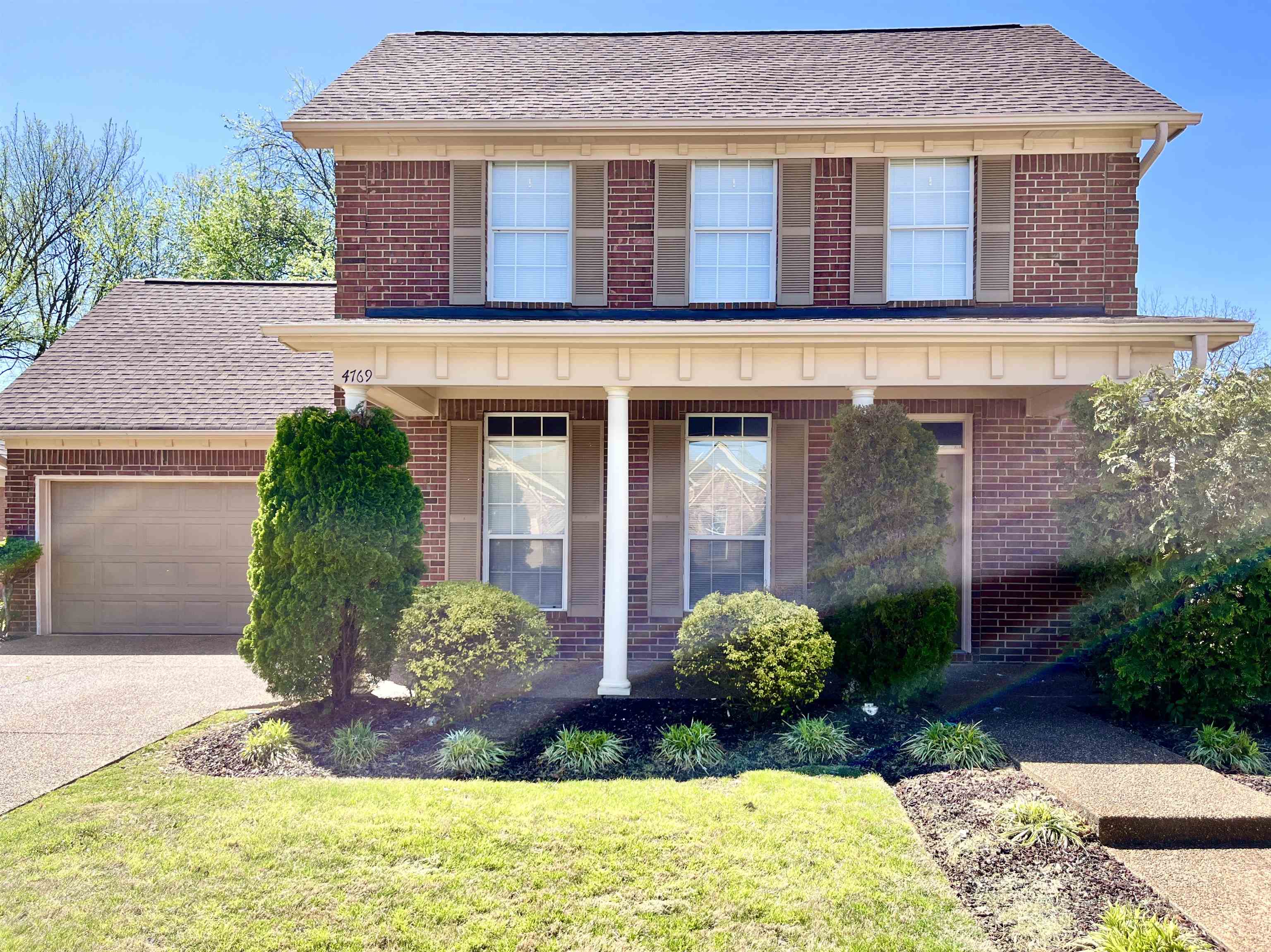 4769 Gilbert Road Memphis, TN 38116 - Photo 1 of 29 a front view of a house with garden
