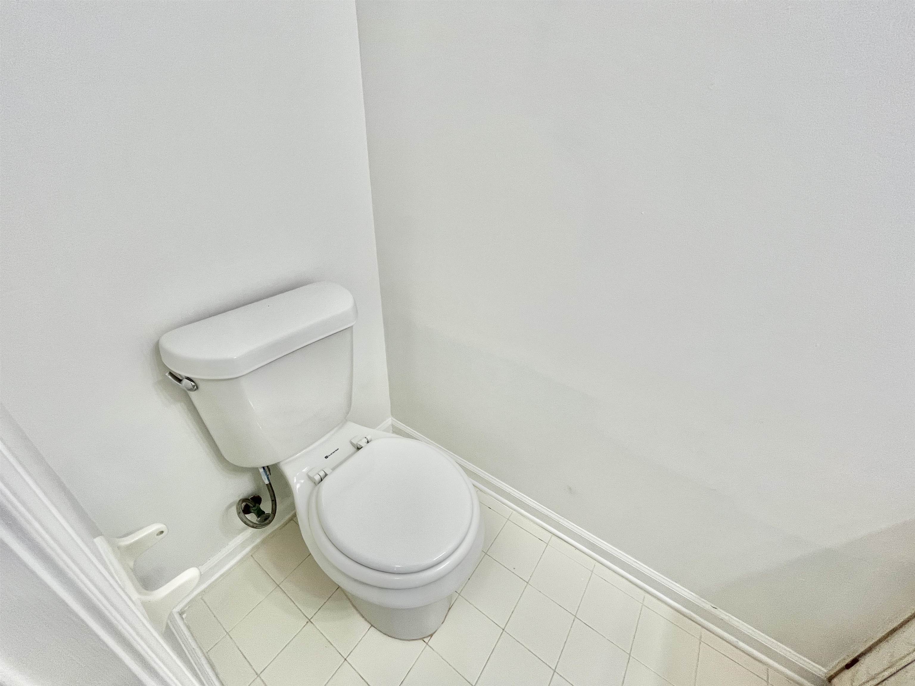 4769 Gilbert Road Memphis, TN 38116 - Photo 11 of 29 a white toilet sitting next to a white sink