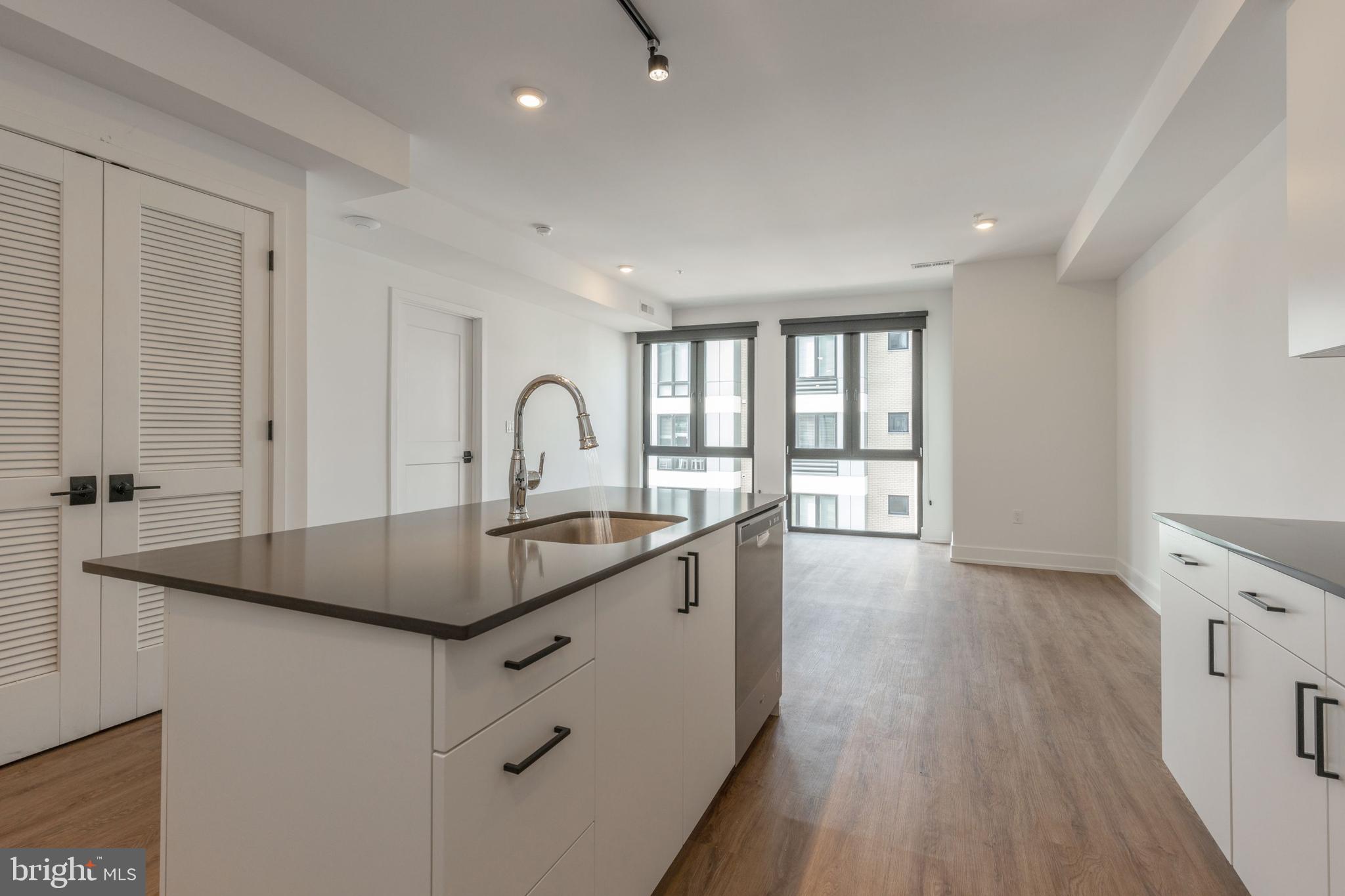 1519 Ridge Avenue, Unit 503 Philadelphia, PA 19130 - Photo 20 of 40 a kitchen with granite countertop a sink a counter space and stainless steel appliances