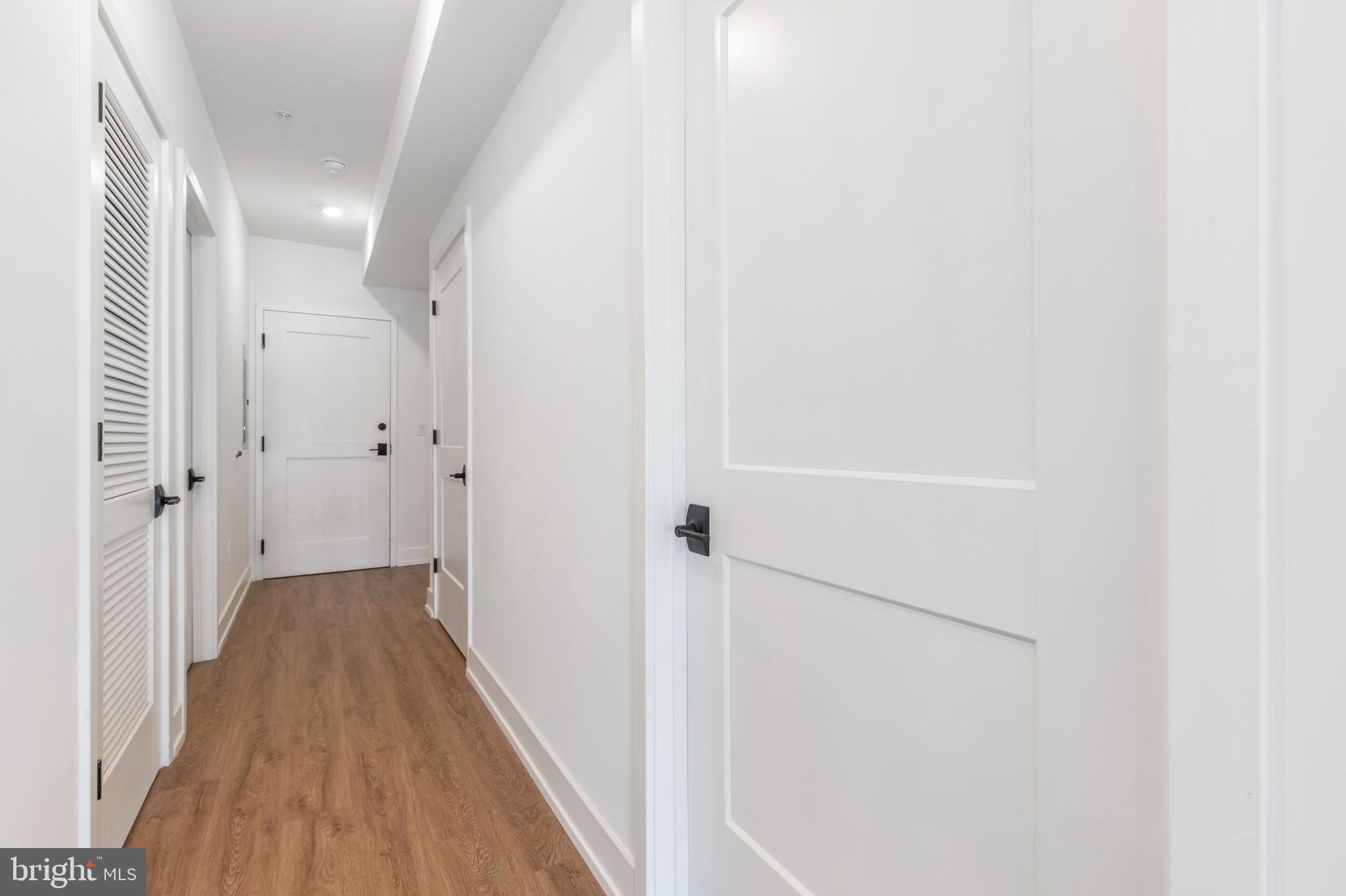 1519 Ridge Avenue, Unit 503 Philadelphia, PA 19130 - Photo 32 of 40 a view of a hallway with wooden floor and staircase
