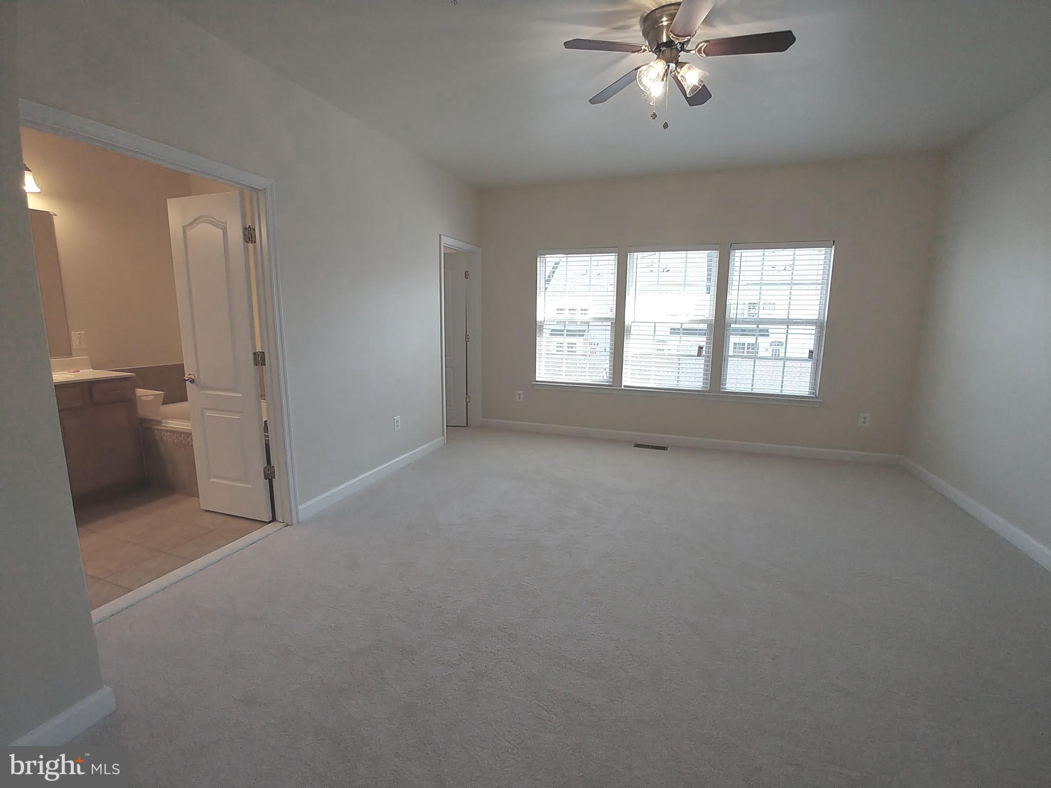 8007 Sport View Road Landover, MD 20785 - Photo 11 of 12 a view of a livingroom with a ceiling fan and window