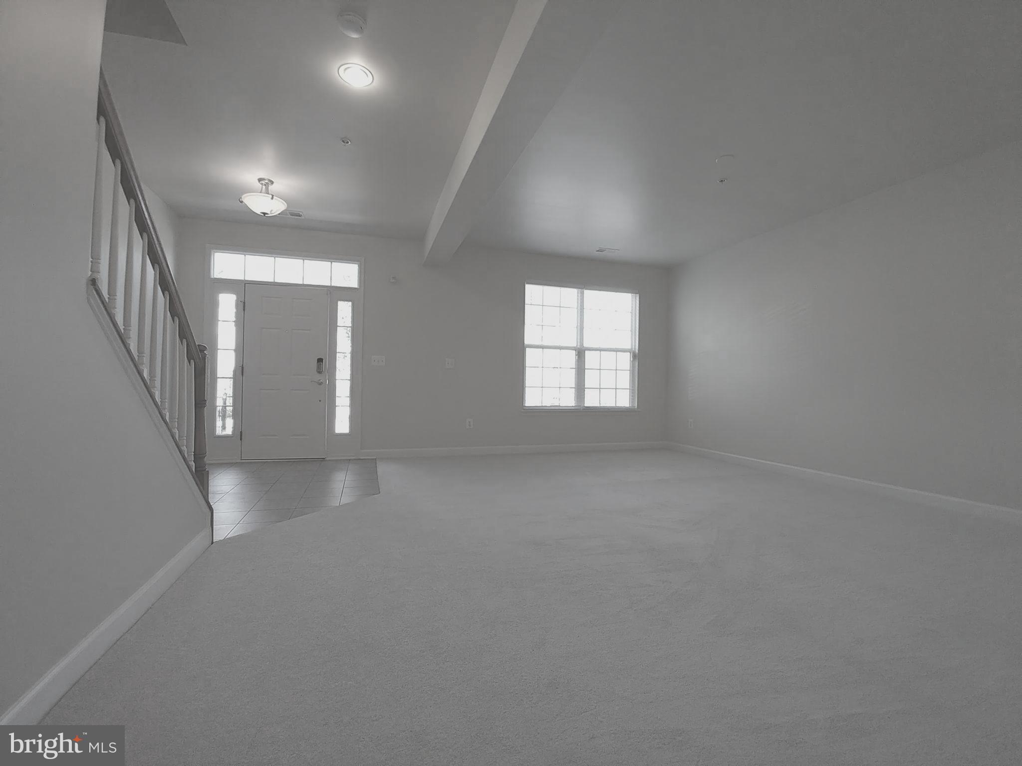 8007 Sport View Road Landover, MD 20785 - Photo 3 of 12 a view of empty room with windows