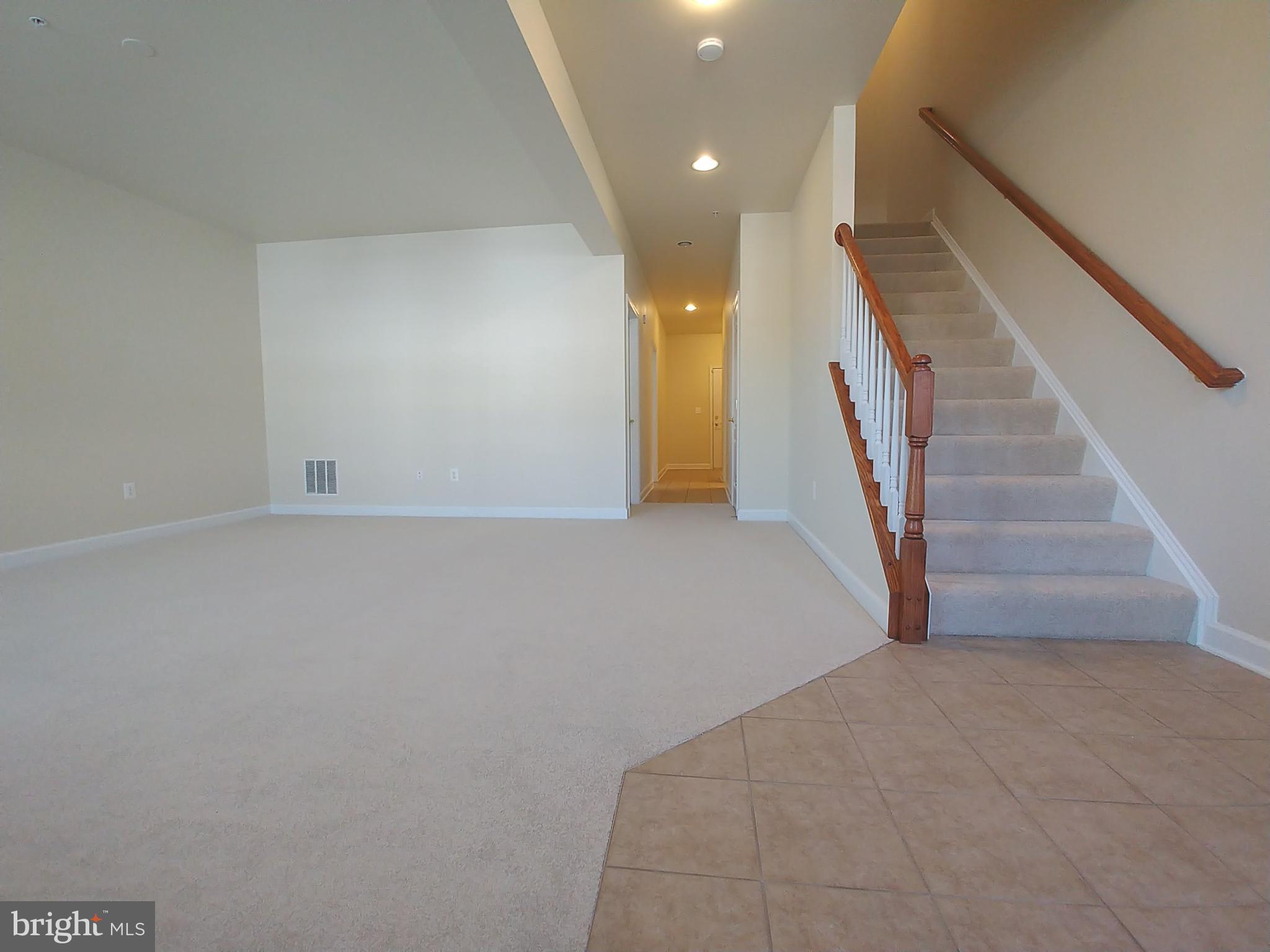 8007 Sport View Road Landover, MD 20785 - Photo 4 of 12 a view of an empty room with stairs