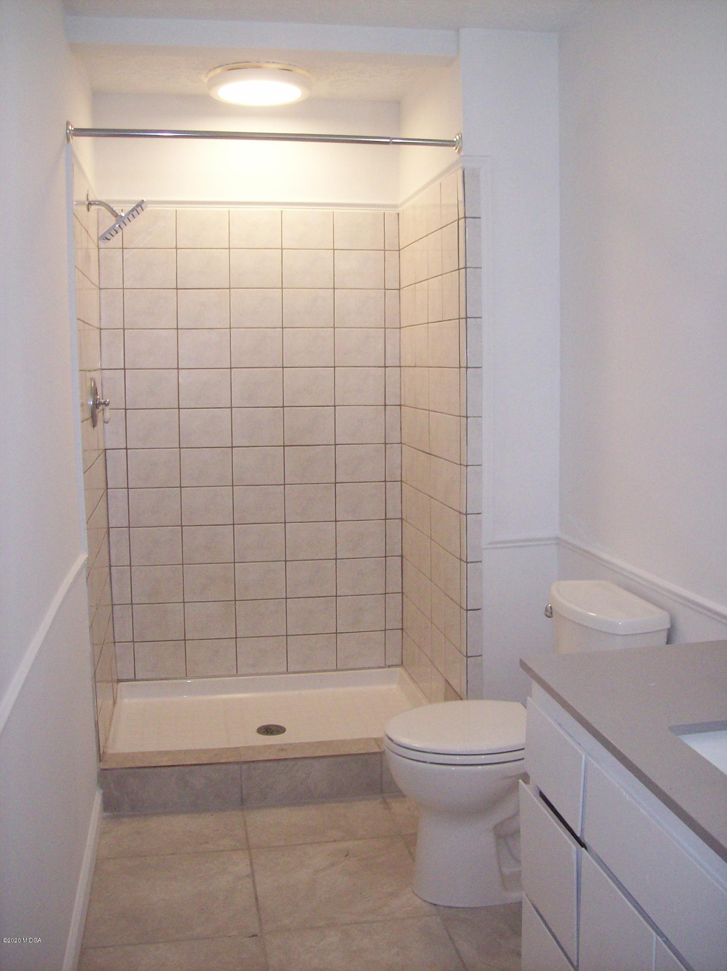 133 Camelot Road Gray, GA 31032 - Photo 22 of 43 a bathroom with a toilet and a shower