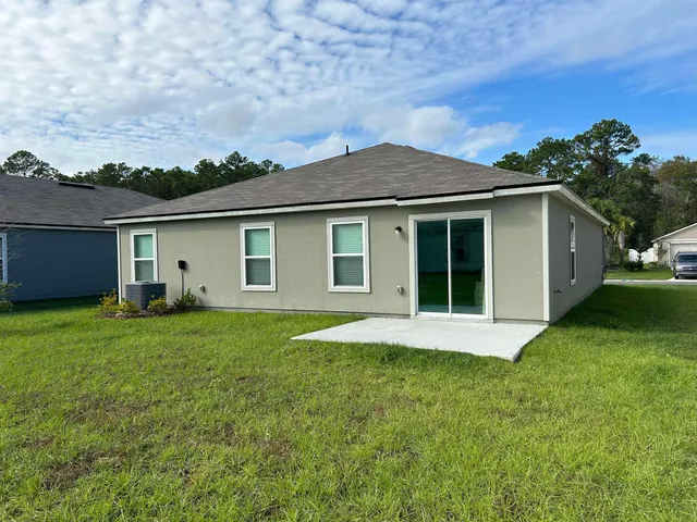 a view of a backyard with a garden