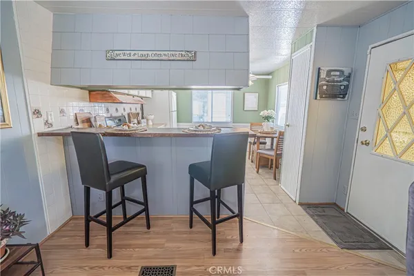 a view of a dining room with furniture and window