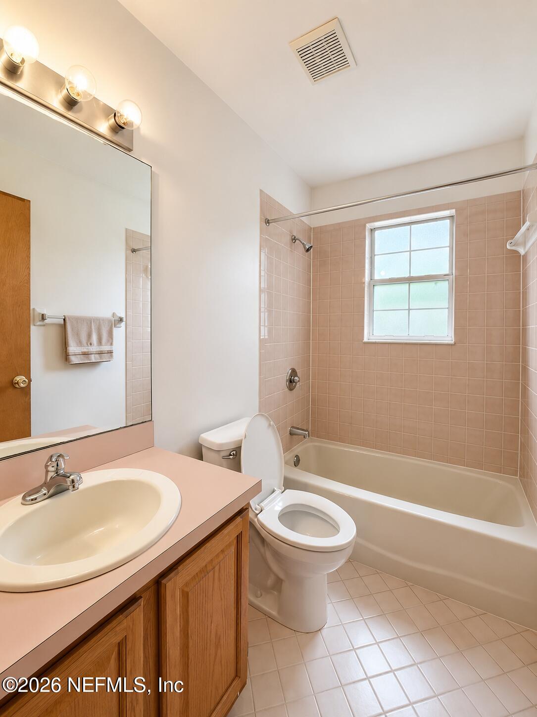 6 Surfcrest Street St. Augustine Beach, FL 32080 - Photo 12 of 15 a bathroom with a sink toilet and shower