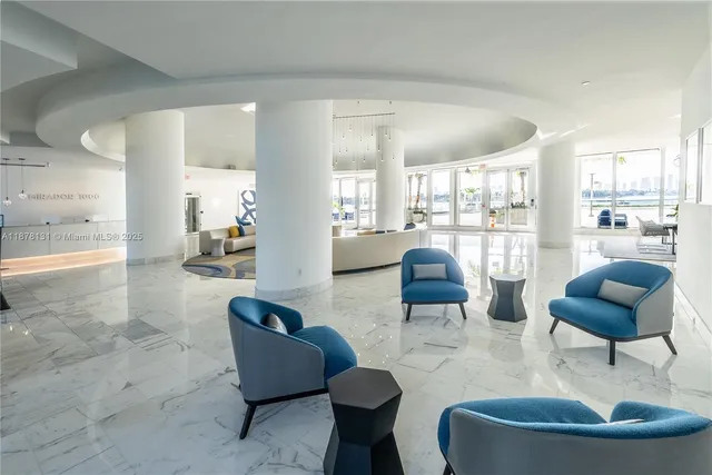 a view of a chairs and table in the patio