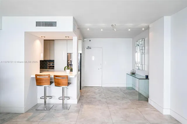 a view of kitchen with cabinets and outdoor living room