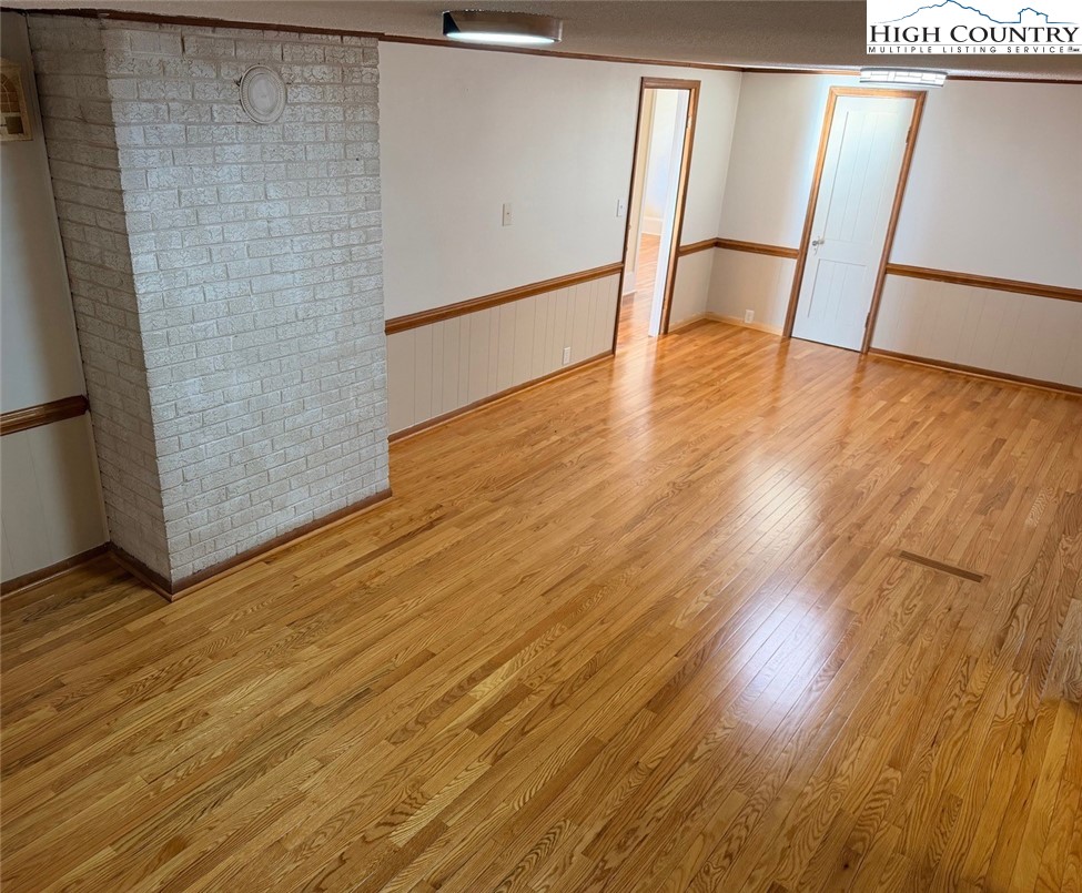 226 White Plains Road Roaring River, NC 28669 - Photo 12 of 39 a view of an empty room with wooden floor