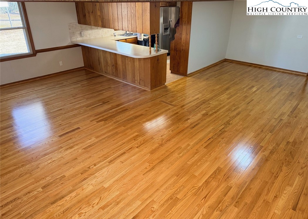 226 White Plains Road Roaring River, NC 28669 - Photo 15 of 39 a view of a kitchen with wooden floor