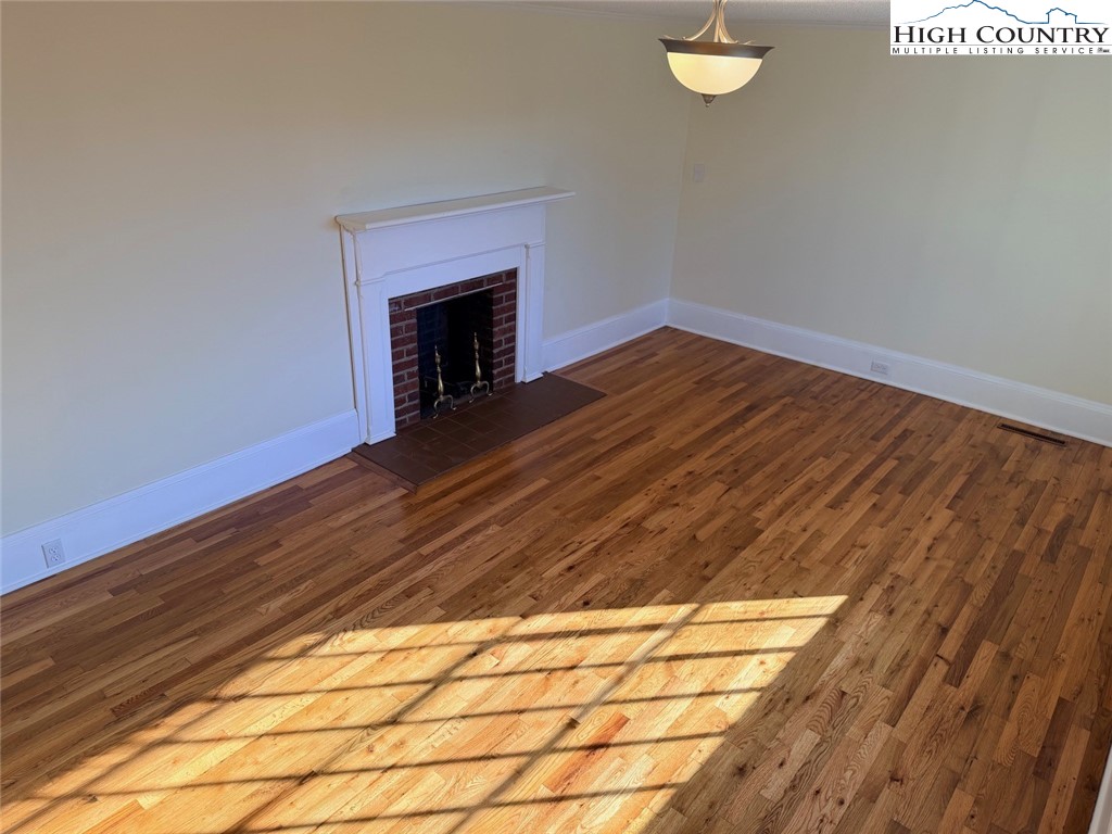 226 White Plains Road Roaring River, NC 28669 - Photo 17 of 39 a view of empty room with wooden floor and fan