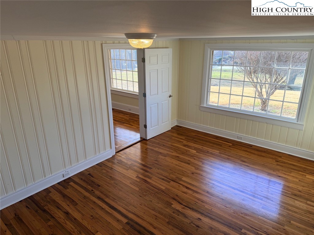 226 White Plains Road Roaring River, NC 28669 - Photo 29 of 39 a view of an empty room with wooden floor and a window
