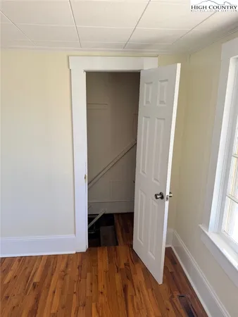 a view of front door with wooden floor