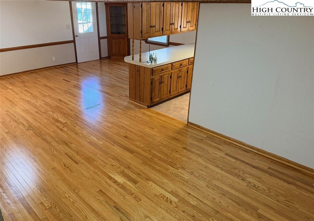 226 White Plains Road Roaring River, NC 28669 - Photo 4 of 39 a view of an empty room with wooden floor