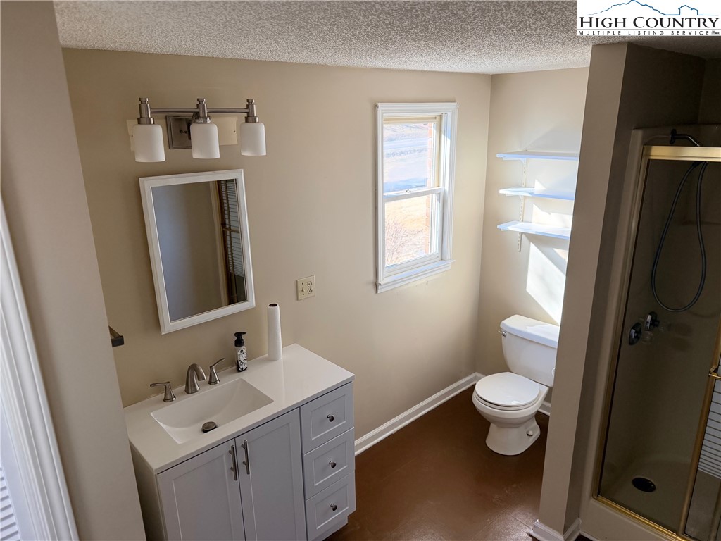 226 White Plains Road Roaring River, NC 28669 - Photo 9 of 39 a bathroom with a sink and a mirror