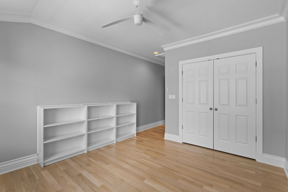 1609 Hartford Road, Unit A Austin, TX 78703 - Photo 31 of 39 Hardwood floors and built-in shelving create a functional and attractive interior.