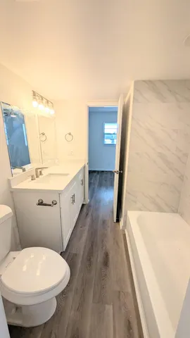 a bathroom with a sink and toilet