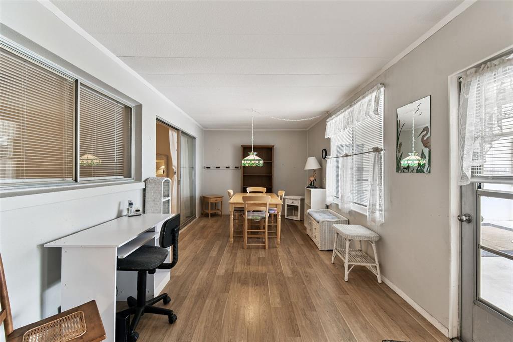 250 Rosery Road Northwest, Unit 333 Largo, FL 33770 - Photo 11 of 63 a living room with furniture and a wooden floor